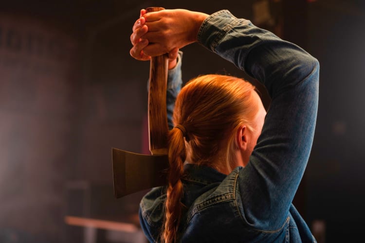 Practicing axe throwing is a fun date idea in Houston