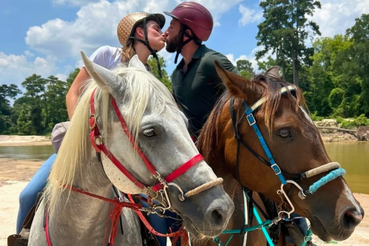 Couple horseback riding