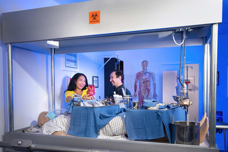 Two people laughing while playing a game at The Great Escape Room in Minneapolis