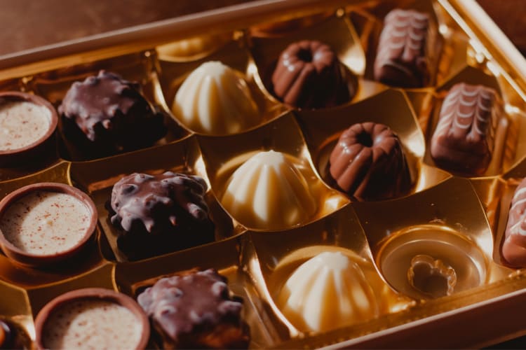 assortment of chocolates in a box with one missing
