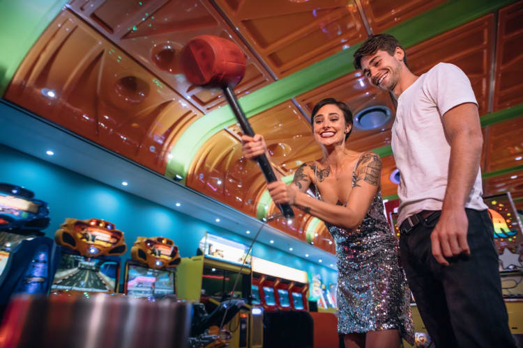 a couple playing an arcade game together