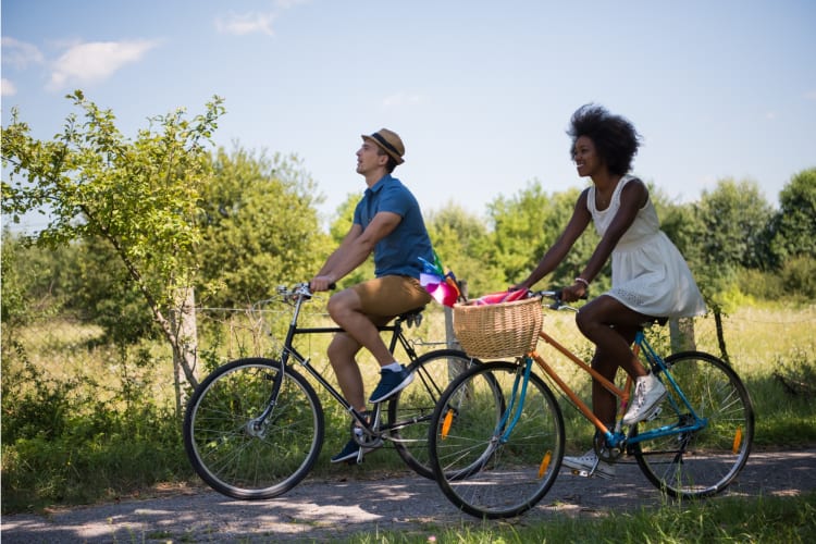 a couple biking along a scenic trail