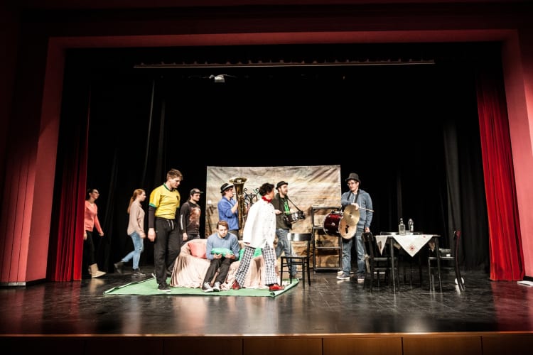 People performing on live theatre