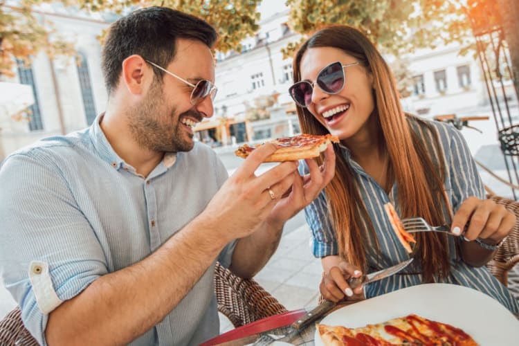Couple enjoy a pizza at Old Sacramento Waterfront