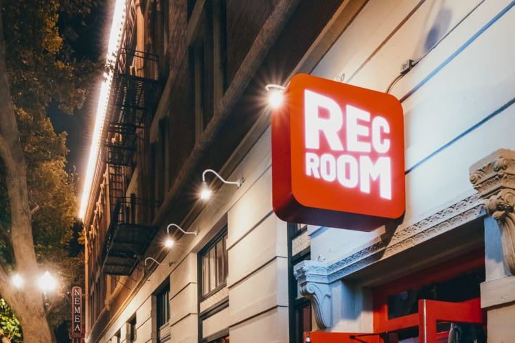 A sign outside a club saying Rec Room.