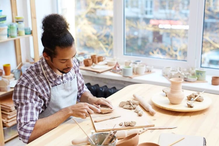 A man taking a class at Pottery Studio 1