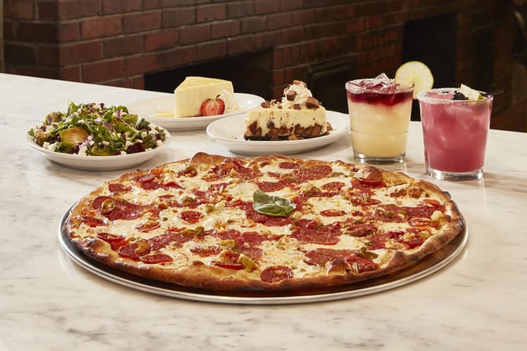 A pizza, salad, two slices of cake and two drinks from Grimaldi’s Pizzeria in NYC