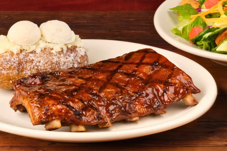 Rack of ribs served with baked potato