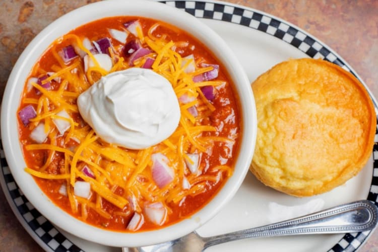 bowl of homemade chili and a cornbread muffin from one of the best diners in Portland