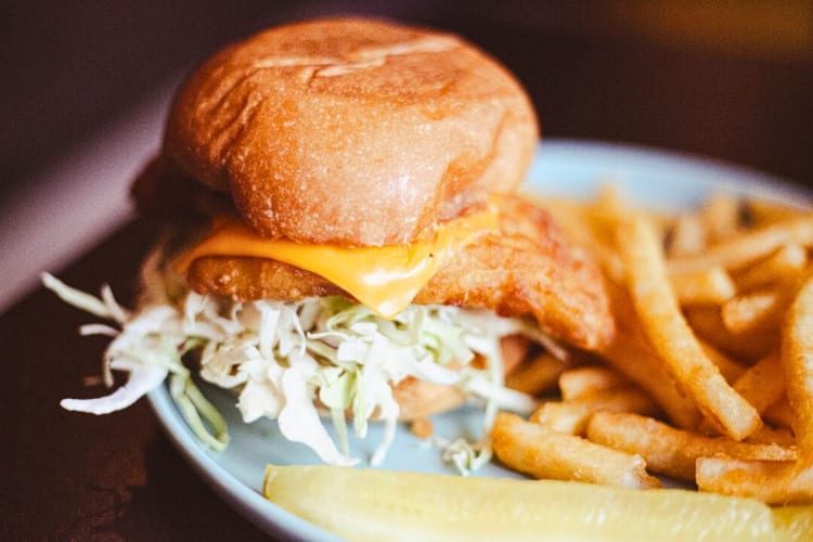 Fish sandwich served with french fries