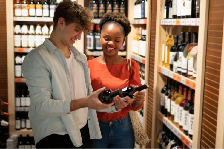 diverse couple selecting alcohol