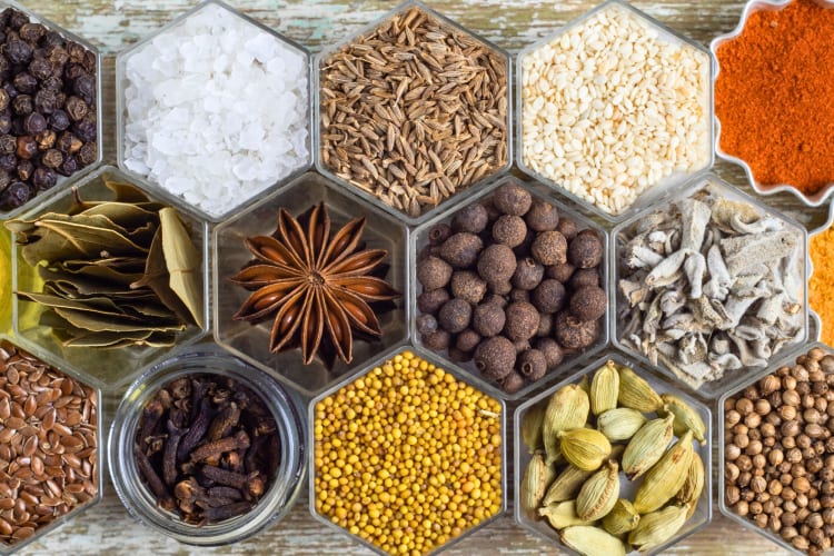 Various spices in hexagonal jars