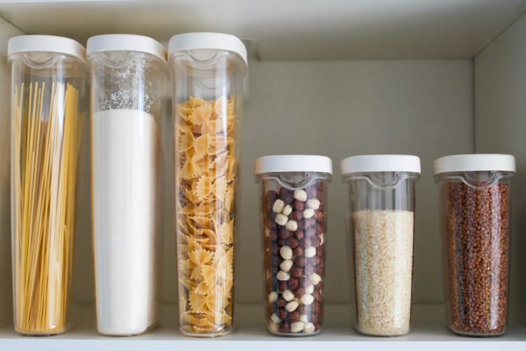 air-proof containers of sugar, rice, pasta, etc. in a pantry