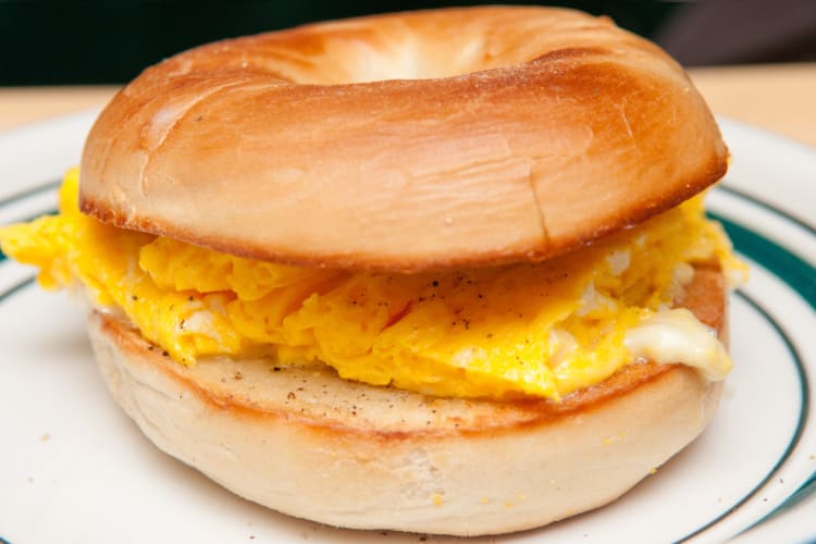 Egg and cheese sandwich served on a bagel