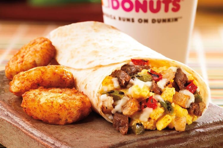 A breakfast burrito and hash browns from Dunkin' Donuts