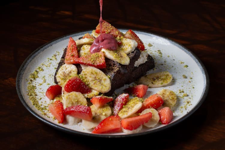 Banana bread topped with fresh fruit