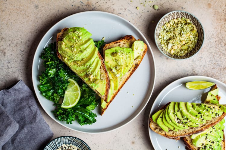 Avocado and kale topped sourdough toast. 