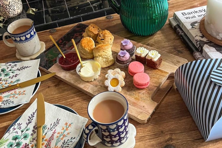 Tea and scones with a selection of baked goods 