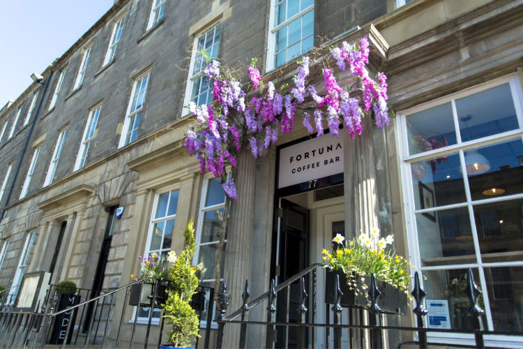 Exterior of a coffee shop serving an Edinburgh breakfast in Spring.