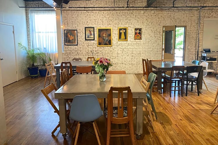A room with three tables and chairs at Ravenswood Loft, a lovely event space in Chicago