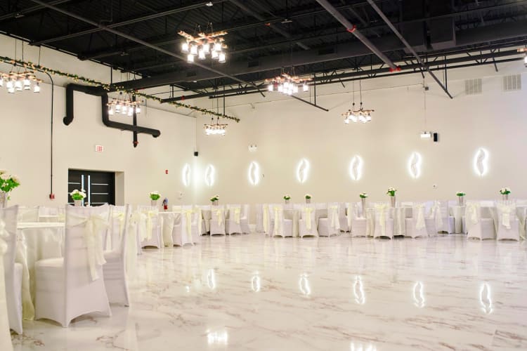 A room at Red Rose Banquets — a great event space in Chicago — decorated with white décor