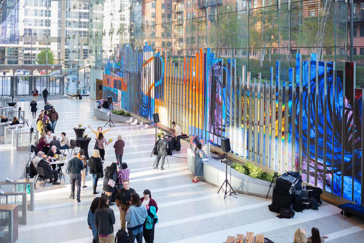 People conversing in an event area at 150 North Riverside, a brilliant event space in Chicago