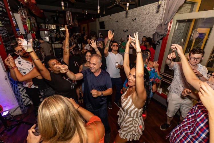 People partying at Top Tomato Bar 
