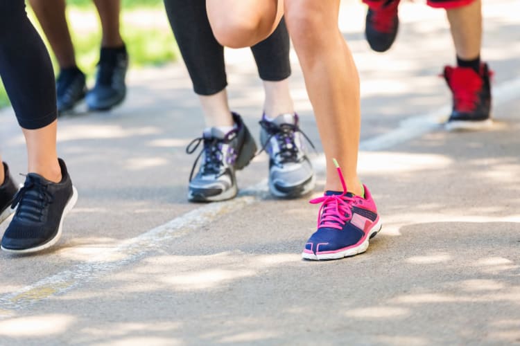 View of runners feet during a 5k race.