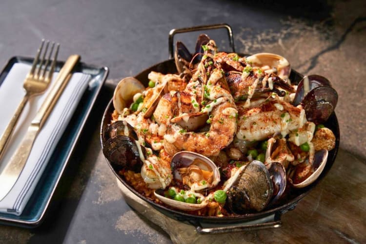 Try the seafood paella at this fancy restaurant in Denver