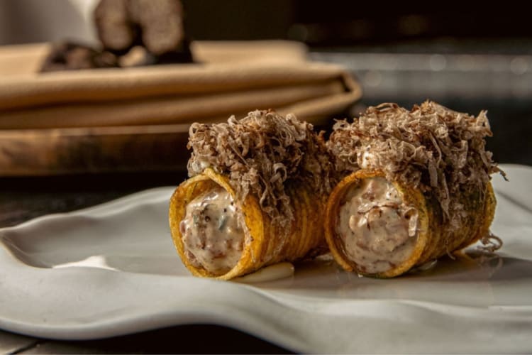 Winter truffle beef tartare cannelloni is a signature dish in the fancy restaurant in Miami