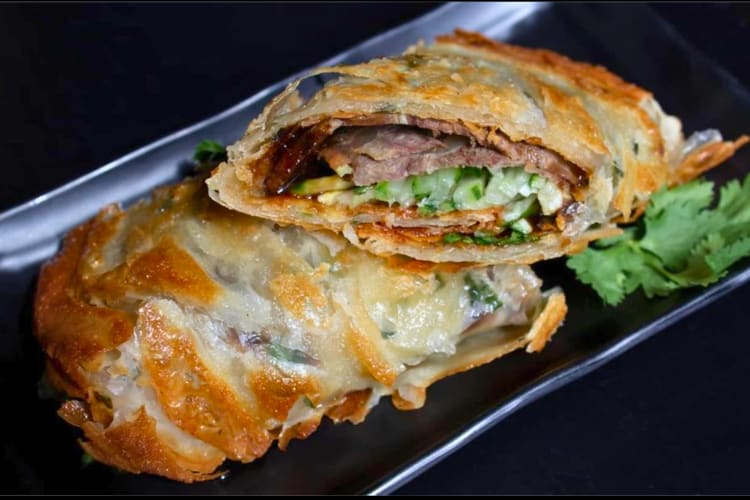 The crispy scallion pancake is a signature fast food in Boston