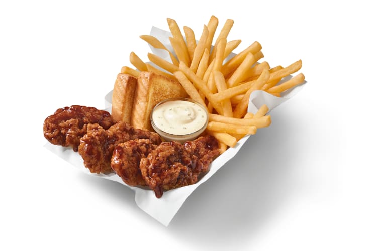 A basket of chicken tenders, fries, toast and sauce from Dairy Queen