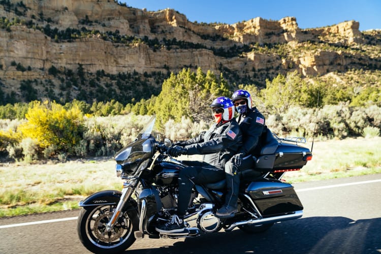 Two people taking a trip on a motorcycle, which is a fun first date idea