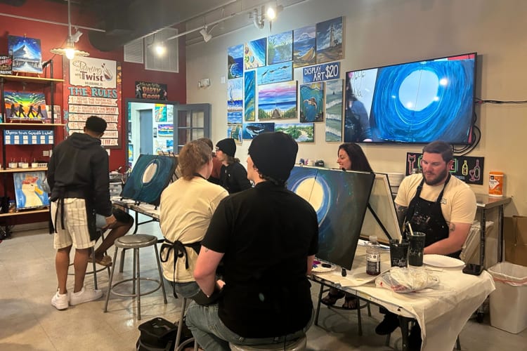 A paint and sip class is a great first date idea for creatives