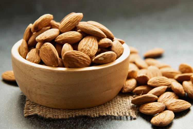 Almonds in a wooden bowl.