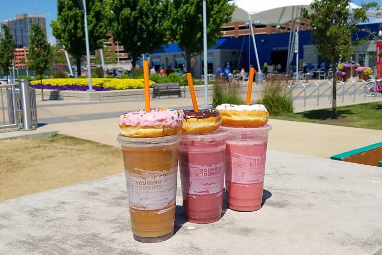 Three drinks topped with doughnuts from Dunkin’ Donuts