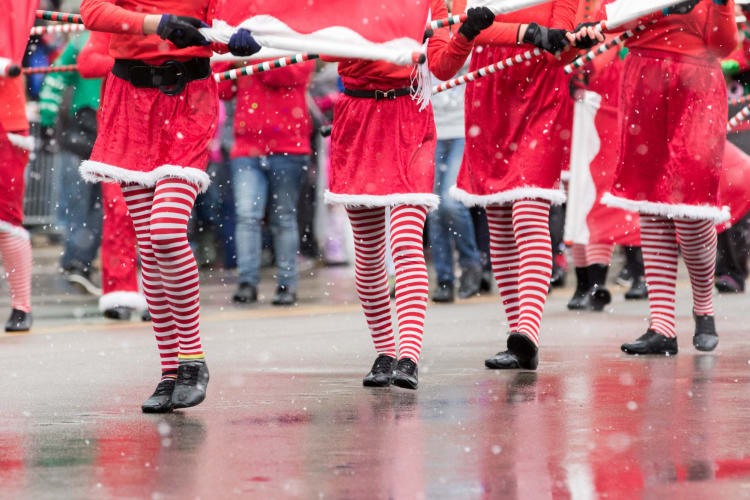 Marchers in a Santa holiday parade.