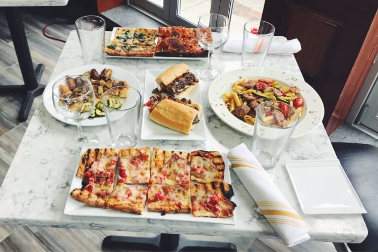 A table filled with food at a gluten-free restaurant in Boston.