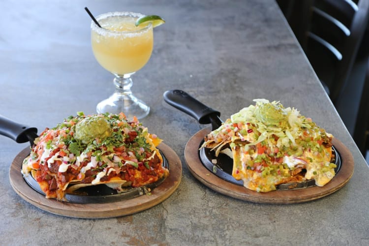 Two portions of nachos and a drink from Nacho Daddy in Las Vegas