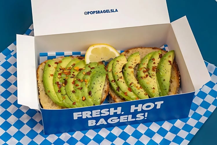 Avocado toast served on a bagel