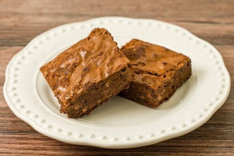 Two brownies on a plate from By the Way Bakery in NYC