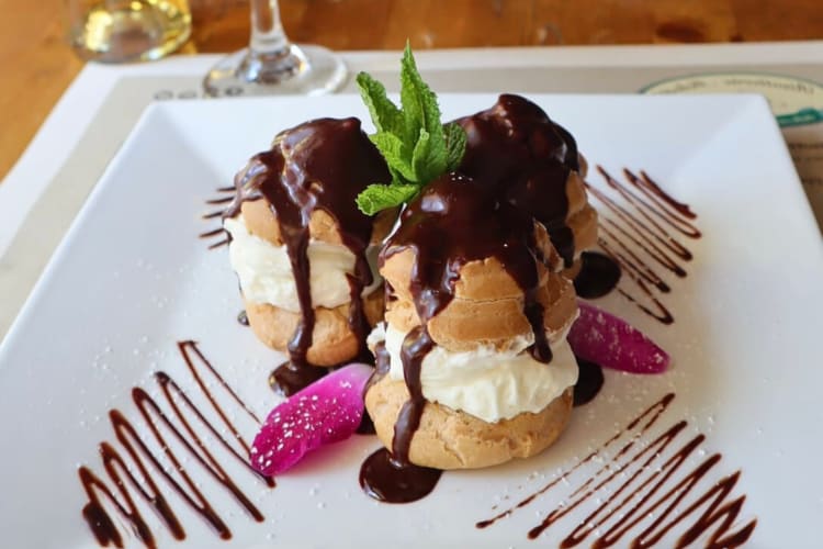 Three profiteroles from Risotteria Melotti, a gluten-free restaurant in NYC