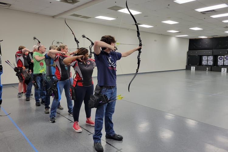 People shooting arrows indoors at Music City Archery