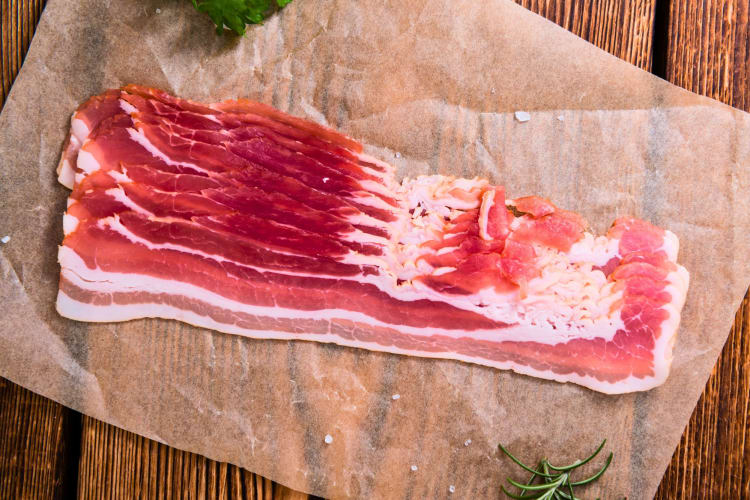 A portion of raw bacon.
