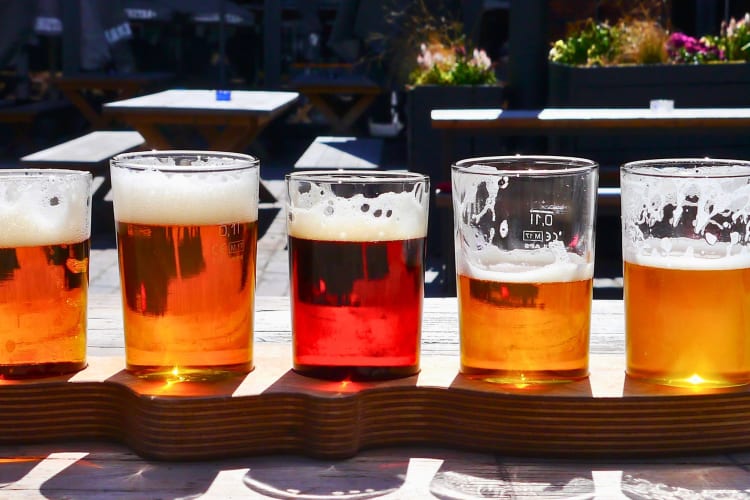 Different beer varieties in pint glasses.