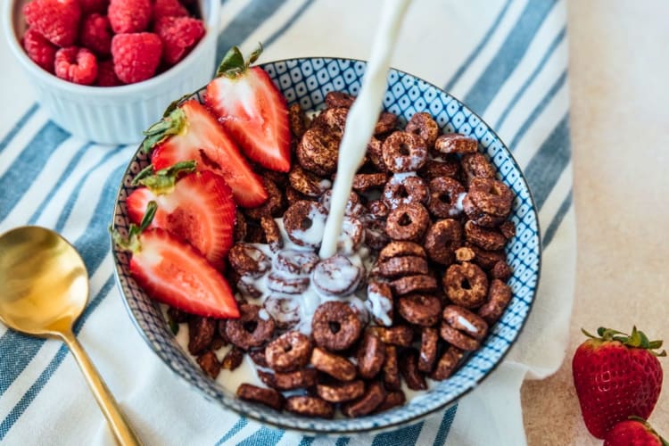 A bowl of chocolate cereal.