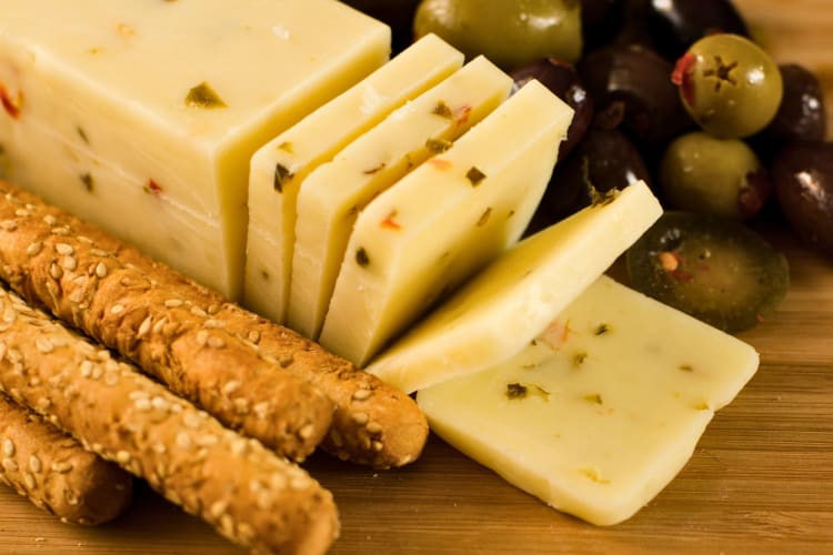 Pepper Jack cheese on a board.