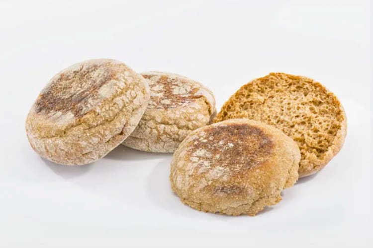 Three English muffins, one cut in half.