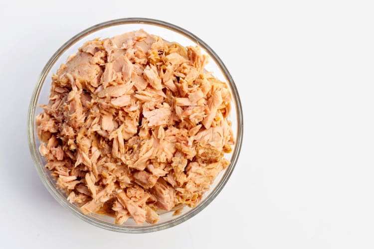 A bowl of flaked tuna.