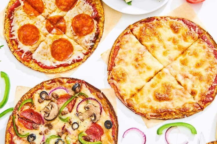 Three different pizzas made from Outer Aisle crust, one of the healthiest frozen pizza products